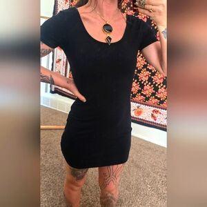 Cotton mini body con black dress criss cross back.